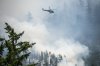 A helicopter works on the Dryden Creek wildfire north of Squamish, B.C., on Tuesday, June 10, 2025. THE CANADIAN PRESS/ Tijana Martin
