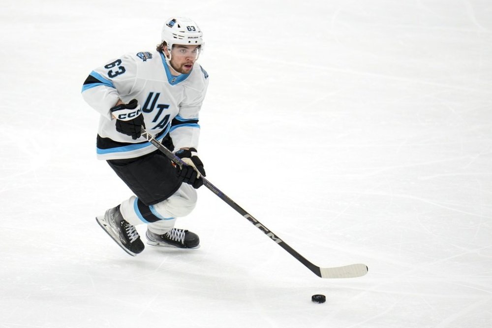Utah Hockey Club left wing Matias Maccelli skates with the puck against the Dallas Stars during the third period of an NHL hockey game, Saturday, Jan. 4, 2025, in Dallas. The Stars won 3-2 in overtime. (AP Photo/Julio Cortez)