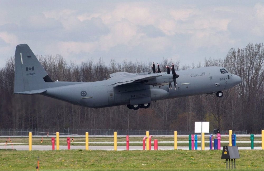 A Canadian Forces CC-130J Hercules transport aircraft takes off from the airstrip at CFB Trenton in Trenton, Ont., on Wednesday, May 4, 2016. THE CANADIAN PRESS/Lars Hagberg