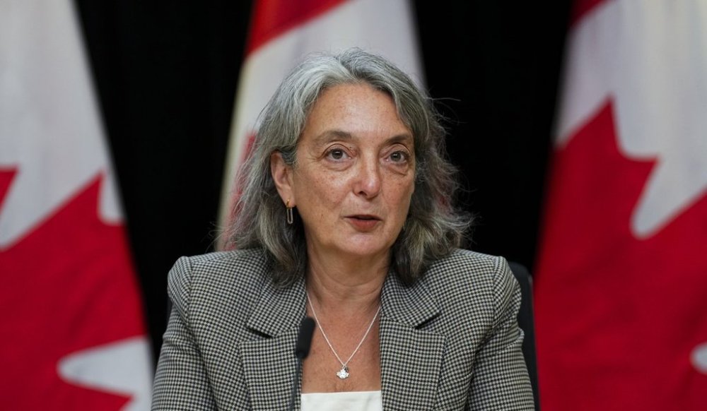 Julie Dabrusin, Minister of Environment and Climate Change, speaks in the National Press Theatre in Ottawa on Thursday, June 12, 2025. THE CANADIAN PRESS/Sean Kilpatrick