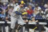 Milwaukee Brewers' Rhys Hoskins runs after hitting a RBI triple to score Jackson Chourio during the second inning of a baseball game against the Miami Marlins, Saturday, July 5, 2025, in Miami. (AP Photo/Lynne Sladky)