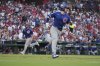 Chicago Cubs' Ian Happ, right, heads to first on a two-run single as teammate Matt Shaw, left, jogs in to score during the fourth inning of a baseball game against the St. Louis Cardinals Wednesday, June 25, 2025, in St. Louis. (AP Photo/Jeff Roberson)