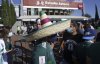 FILE - Mexico fans arrive at Azteca stadium for a qualifying soccer match for the FIFA World Cup Qatar 2022 against Honduras in Mexico City, Oct. 10, 2021. (AP Photo/Eduardo Verdugo, File)