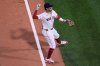 Boston Red Sox third baseman Marcelo Mayer fields a single by Cincinnati Reds' Christian Encarnacion-Strand during the third inning of a baseball game at Fenway Park, Tuesday, July 1, 2025, in Boston. (AP Photo/Charles Krupa)