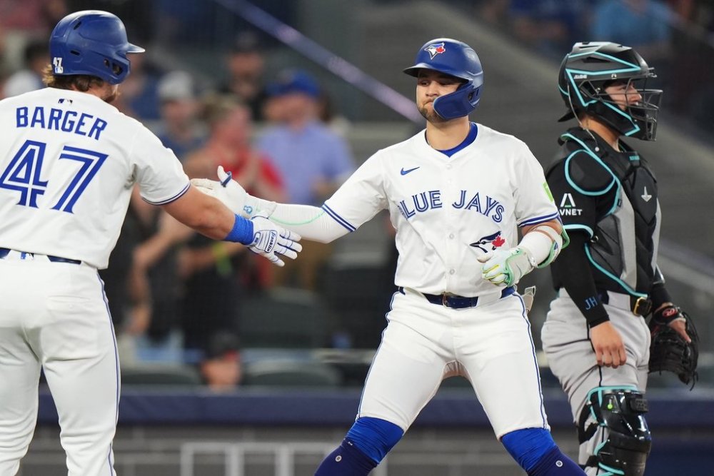 Blue Jays shortstop Bo Bichette (right) celebrates a leadoff home run with teammate Addison Barger during a Major League Baseball game against the Arizona Diamondbacks in Toronto on Wednesday, June 18, 2025. THE CANADIAN PRESS/Frank Gunn