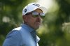 Phil Mickelson watches his tee shot on the 13th hole during the first round of the U.S. Open golf tournament at Oakmont Country Club Thursday, June 12, 2025, in Oakmont, Pa. (AP Photo/Carolyn Kaster)
