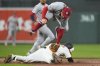 Baltimore Orioles' Cedric Mullins, below, steals second base in front of St. Louis Cardinals second baseman Brendan Donovan during the second inning of a baseball game, Wednesday, May 28, 2025, in Baltimore. (AP Photo/Stephanie Scarbrough)