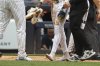 New York Yankees' Jazz Chisholm Jr. walks to the dugout without shoes after scoring during the second inning of a baseball game against the Baltimore Orioles, Sunday, June 22, 2025, in New York. (AP Photo/Pamela Smith)
