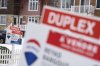The Canadian Real Estate Association says home sales in May fell 4.3 per cent compared with a year ago, however activity picked up when compared to the previous month. A real estate sign showing homes for sale is seen in Montreal on Monday, March 24, 2025. THE CANADIAN PRESS/Christinne Muschi