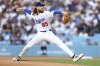 Los Angeles Dodgers pitcher Dustin May throws to a Chicago White Sox batter during the first inning of a baseball game, Thursday, July 3, 2025, in Los Angeles. (AP Photo/Jessie Alcheh)