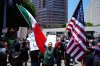 Protesters gather to denounce ICE, U.S Immigration and Customs Enforcement, operations Tuesday, June 10, 2025, in Los Angeles. (AP Photo Damian Dovarganes)