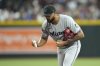 Miami Marlins starting pitcher Sandy Alcantara tosses away the rosin bag during the fourth inning of a baseball game against the Arizona Diamondbacks Saturday, June 28, 2025, in Phoenix. (AP Photo/Ross D. Franklin)