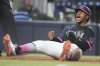 Miami Marlins' Xavier Edwards reacts after scoring on a single hit by Agustin Ramirez during the eighth inning of a baseball game against the Milwaukee Brewers, Saturday, July 5, 2025, in Miami. (AP Photo/Lynne Sladky)