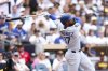 Los Angeles Dodgers' Teoscar Hernandez hits a three-run home run against the San Diego Padres in the sixth inning of a baseball game Wednesday, June 11, 2025, in San Diego. (AP Photo/Derrick Tuskan)