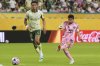 Inter Miami's Lionel Messi shoots on goal against Palmeiras' Richard Rios during the Club World Cup Group A soccer match between Inter Miami and Palmeiras in Miami Gardens, Fla., Monday, June 23, 2025. (AP Photo/Lynne Sladky)