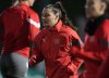 FILE - Switzerland's Ramona Bachmann, center, warms up during a training session in Dunedin, New Zealand, July 29, 2023. (AP Photo/Alessandra Tarantino, file)