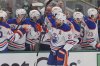 Edmonton Oilers center Leon Draisaitl (29) celebrates his goal with the bench during the first period in Game 1 of the Western Conference finals in the NHL hockey Stanley Cup playoffs against the Dallas Stars, Wednesday, May 21, 2025, in Dallas. (AP Photo/LM Otero)