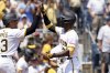 Pittsburgh Pirates' Andrew McCutchen, right, celebrates with Ke'Bryan Hayes, left, after hitting a three-run home run during the fifth inning of a baseball game against the Miami Marlins Wednesday, June 11, 2025, in Pittsburgh. (AP Photo/Matt Freed)