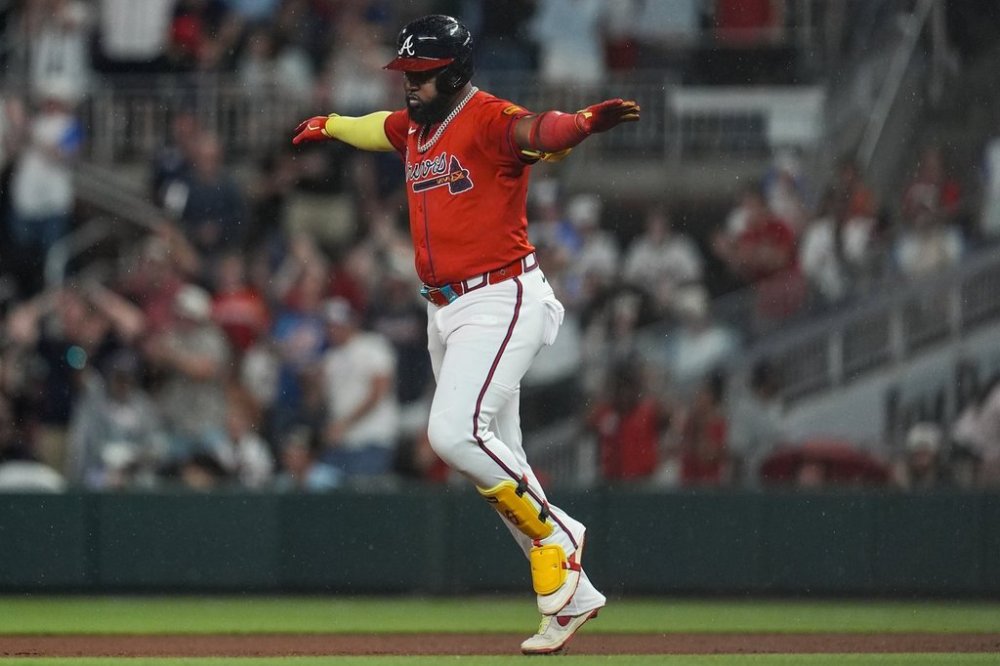 Atlanta Braves designated hitter Marcell Ozuna (20) celebrates his three-run homer against the Colorado Rockies in the seventh inning of a baseball game, Friday, June 13, 2025, in Atlanta. (AP Photo/Mike Stewart)