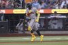 Atlanta Braves' Ronald Acuña Jr. reacts after hitting a home run during the third inning of a baseball game against the New York Mets, Monday, June 23, 2025, in New York. (AP Photo/Pamela Smith)