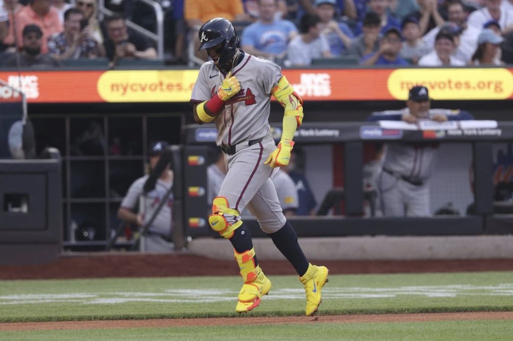Atlanta Braves' Ronald Acuña Jr. reacts after hitting a home run during the third inning of a baseball game against the New York Mets, Monday, June 23, 2025, in New York. (AP Photo/Pamela Smith)