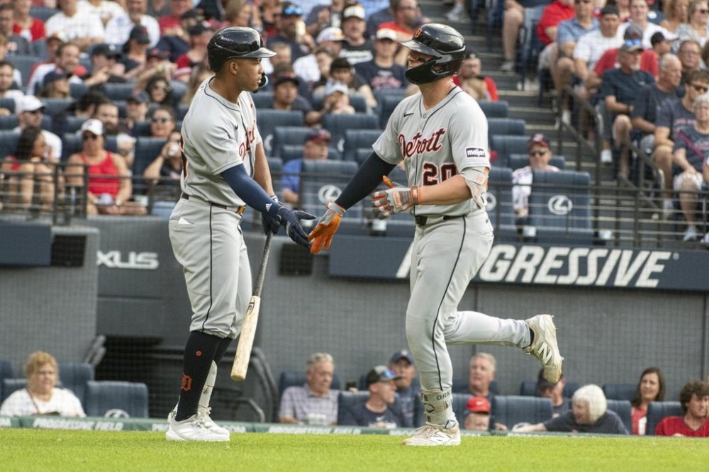 Detroit Tigers' Spencer Torkelson, right, is congratulated by Wenceel Perez, left, after hitting a solo home run off Cleveland Guardians starting pitcher Logan Allen during the second inning of a baseball game, Saturday, July 5, 2025, in Cleveland. (AP Photo/Phil Long)
