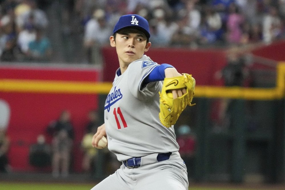 FILE - Los Angeles Dodgers pitcher Roki Sasaki, of Japan, throws against the Arizona Diamondbacks during the second inning of a baseball game Friday, May 9, 2025, in Phoenix. (AP Photo/Darryl Webb, File)