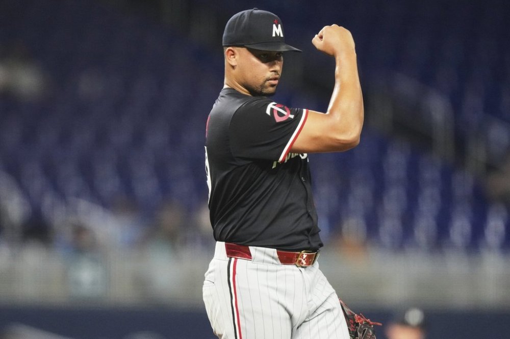 Minnesota Twins relief pitcher Jhoan Duran reacts after getting the final out during the ninth inning of a baseball game against the Miami Marlins, Wednesday, July 2, 2025, in Miami. (AP Photo/Lynne Sladky)