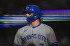 Kansas City Royals' Bobby Witt Jr. returns to the dugout after scoring on a single by Maikel Garcia during the first inning of a baseball game against the Texas Rangers Tuesday, June 17, 2025, in Arlington, Texas. (AP Photo/Julio Cortez)