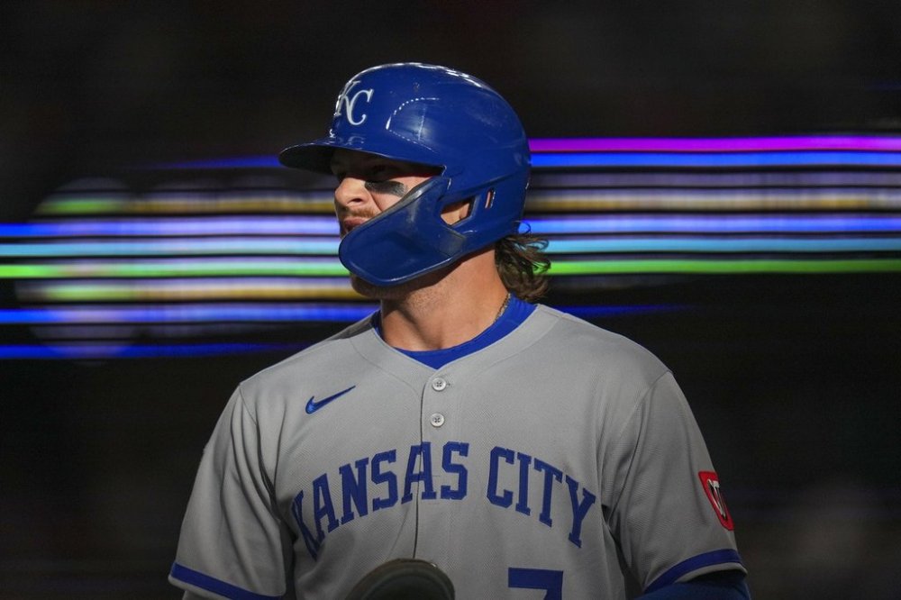 Kansas City Royals' Bobby Witt Jr. returns to the dugout after scoring on a single by Maikel Garcia during the first inning of a baseball game against the Texas Rangers Tuesday, June 17, 2025, in Arlington, Texas. (AP Photo/Julio Cortez)