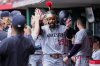 Minnesota Twins' Byron Buxton celebrates in the dugout hitting the the second in back-to-back home runs during the second inning of a baseball game against the Cincinnati Reds, Thursday, June, 19, 2025, in Cincinnati. (AP Photo/Grace Bradley)
