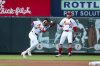St. Louis Cardinals' Masyn Winn, left, catches a fly ball for an out against Toronto Blue Jays' Addison Barger while Brendan Donovan watches during the first inning of a baseball game Tuesday, June 10, 2025, in St. Louis. (AP Photo/Scott Kane)