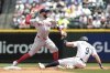 Boston Red Sox shortstop Trevor Story, left, tags to get Seattle Mariners' Ben Williamson (9) out at second during the second inning of a baseball game, Wednesday, June 18, 2025, in Seattle. (AP Photo/Jason Redmond)