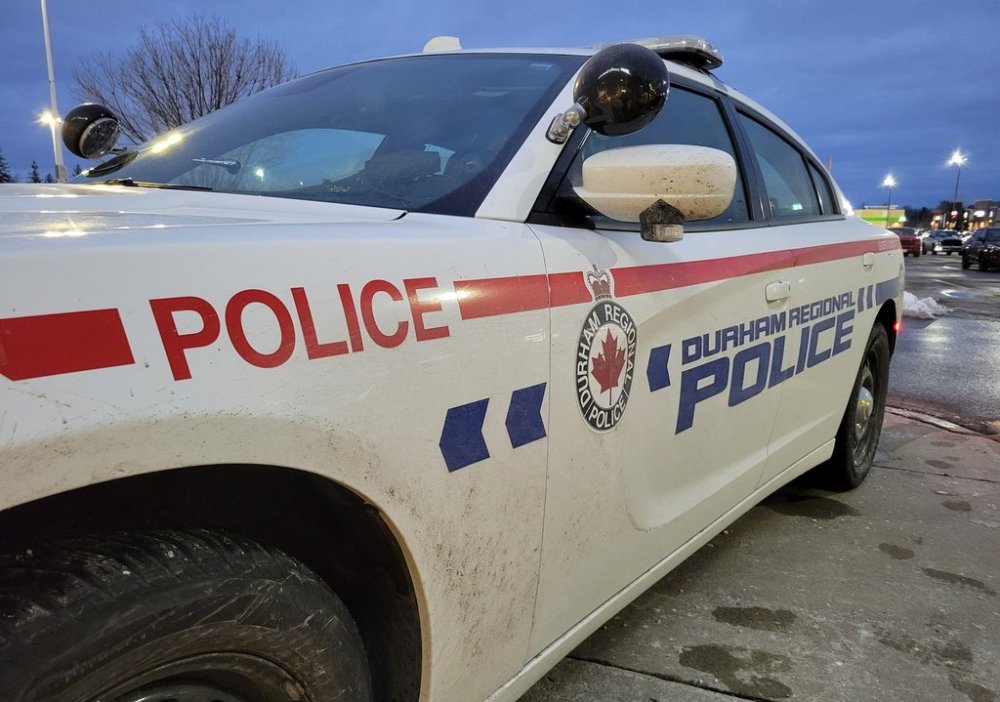 A Durham Regional Police car is shown at a Bowmanville, Ont. shopping centre parking lot on Tuesday Feb. 28, 2023. THE CANADIAN PRESS/Doug Ives