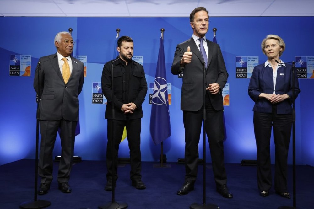 From left, European Council President Antonio Costa, Ukraine's President Volodymyr Zelenskyy, NATO Secretary General Mark Rutte and European Commission President Ursula von der Leyen speak prior to a meeting on the sidelines of the NATO summit in The Hague, Netherlands, Tuesday, June 24, 2025. (AP Photo/Geert Vanden Wijngaert)