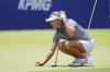 Lexi Thompson lines up a putt on the 18th hole during the second round of the Women's PGA Championship golf tournament Friday, June 20, 2025, in Frisco, Texas. (AP Photo/LM Otero)