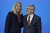 FILE - IOC President Thomas Bach, right, greets Kirsty Coventry after she was announced as the new IOC President at the International Olympic Committee 144th session in Costa Navarino, western Greece, Thursday, March 20, 2025. (AP Photo/Thanassis Stavrakis, File)