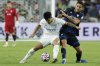 Al-Hilal's Marcos Leonardo, left, and Pachuca's Agustin Palavecino fight for the ball during the Club World Cup Group H soccer match between Al Hilal and CF Pachuca in Nashville, Tenn., Thursday, June 26, 2025. (AP Photo/Johnnie Izquierdo)