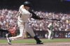 San Francisco Giants' Wilmer Flores hits a two-run double against the Cleveland Guardians during the seventh inning of a baseball game in San Francisco, Thursday, June 19, 2025. (AP Photo/Jeff Chiu)