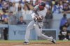 Washington Nationals' Jacob Young hits a double during the third inning of a baseball game against the Los Angeles Dodgers in Los Angeles, Saturday, June 21, 2025. (AP Photo/Jessie Alcheh)