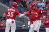 Toronto Blue Jays outfielder George Springer (4) celebrates with catcher Tyler Heineman (55) after hitting a grand slam off of New York Yankees pitcher Luke Weaver during seventh inning MLB baseball action in Toronto on Tuesday, July 1, 2025. THE CANADIAN PRESS/Frank Gunn