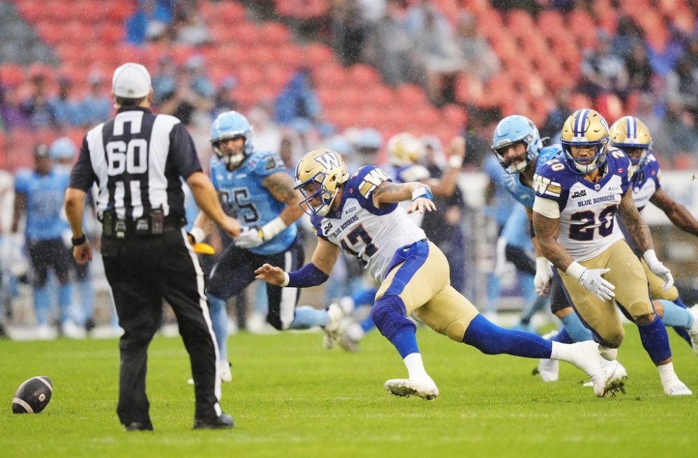 Winnipeg Blue Bombers quarterback Chris Streveler (17) scrambles to recover the football during first half CFL football action against the Toronto Argonauts in Toronto on Saturday, July 26, 2025. THE CANADIAN PRESS/Nathan Denette