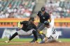 Arizona Diamondbacks shortstop Geraldo Perdomo, left, is unable to catch Detroit Tigers' Wenceel Perez stealing second during the fifth inning of a baseball game Tuesday, July 29, 2025, in Detroit. (AP Photo/Ryan Sun)