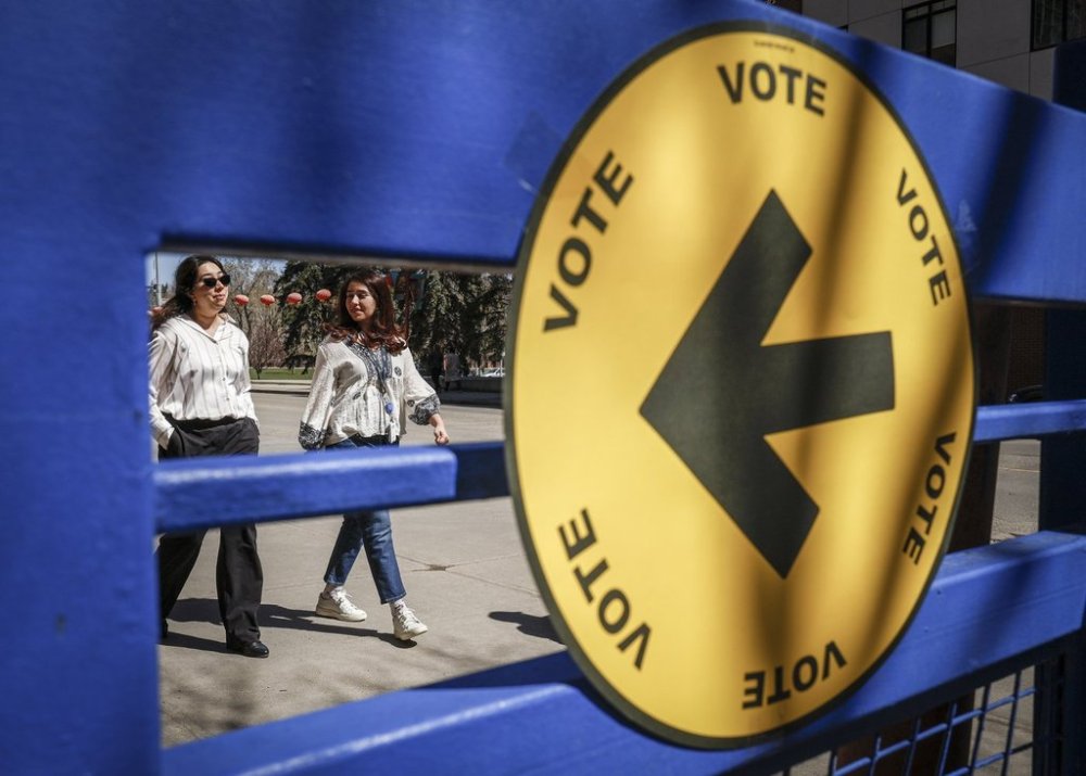 A sign directs voters to a polling station to cast their ballots in the federal election in Calgary, Monday, April 28, 2025. THE CANADIAN PRESS/Jeff McIntosh