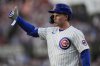 Chicago Cubs' Pete Crow-Armstrong (4) signals to the dugout after hitting a one-run single during the third inning of a baseball game against the Cleveland Guardians, Wednesday, July 2, 2025, in Chicago. (AP Photo/Erin Hooley)