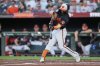 Baltimore Orioles' Cedric Mullins hits a two-run home run during the second inning of a baseball game against the Toronto Blue Jays, Monday, July 28, 2025, in Baltimore. (AP Photo/Stephanie Scarbrough)