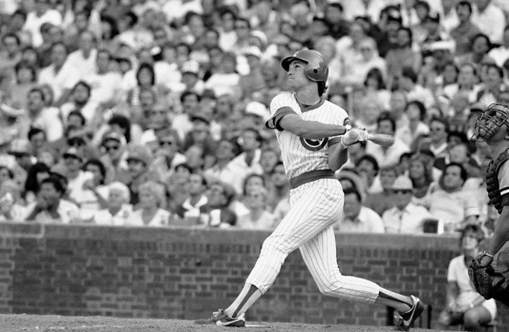 FILE - Chicago Cubs ' Ryne Sandberg slugs a triple during Wednesday, Aug. 29, 1984 game against the Cincinnati Reds in Chicago. (AP Photo/Jon Swart,File)
