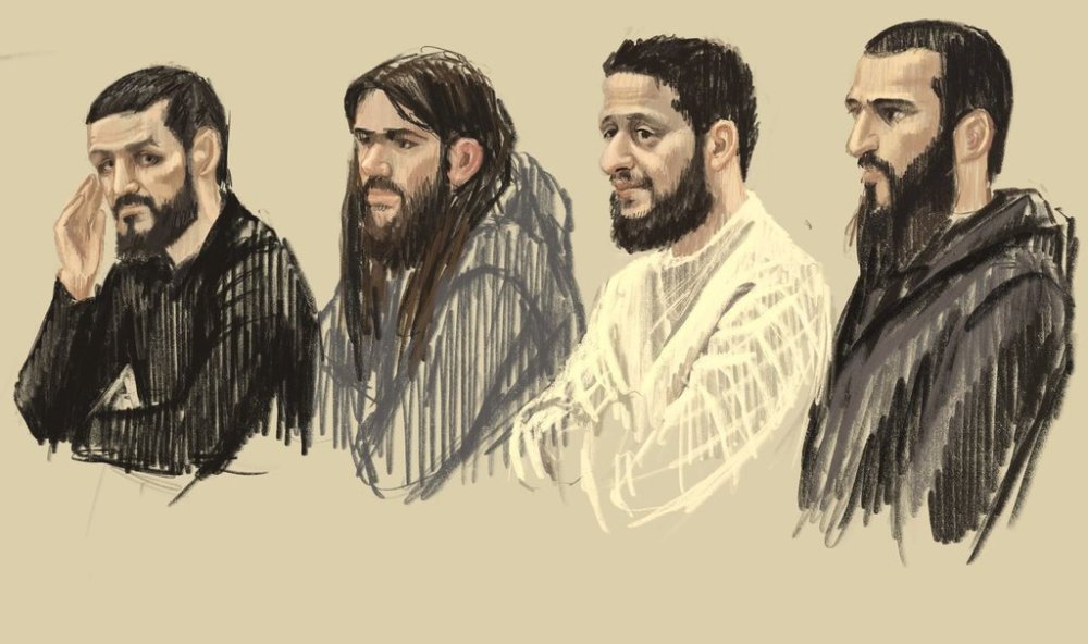 FILE - In this courtroom sketch, defendants from left, Mohamed Abrini, Osama Krayem, Salah Abdeslam and Sofiane Ayari look out from a specially designed glass box during the trial for the Brussels attacks, that took place on March 22, 2016, at the Justitia building in Brussels, Dec. 5, 2022. (Petra Urban via AP, File)