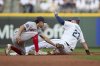 Seattle Mariners' Rowdy Tellez steals second as Boston Red Sox second baseman David Hamilton reaches to tag during the second inning of a baseball game, Tuesday, June 17, 2025, in Seattle. (AP Photo/John Froschauer)