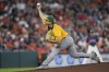 Athletics starting pitcher J.T. Ginn throws against the Houston Astros during the first inning of a baseball game Sunday, July 27, 2025, in Houston. (AP Photo/David J. Phillip)
